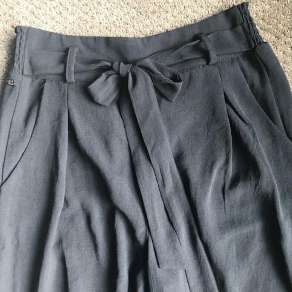 Black crepe cropped trousers.
